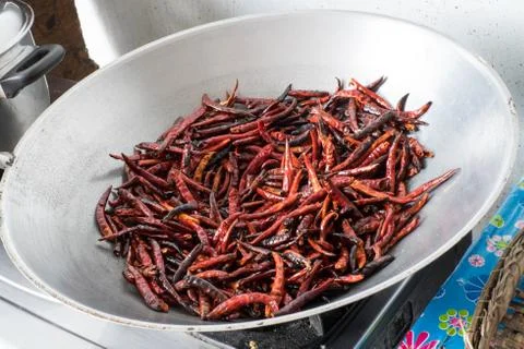 Chilli dry in the pan Stock Photos