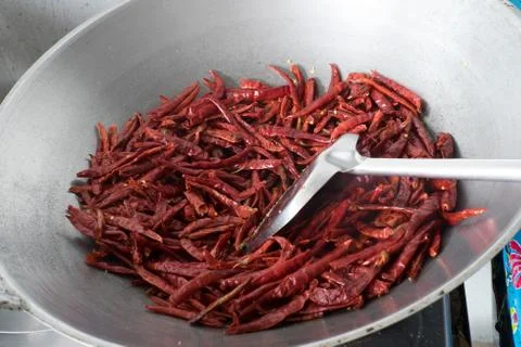 Chilli dry in the pan Stock Photos