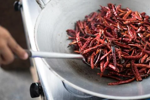Chilli dry in the pan Stock Photos
