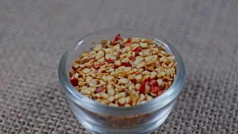 Chilli flakes in bowl circle short 4k 25fps Stock-Footage 272164559