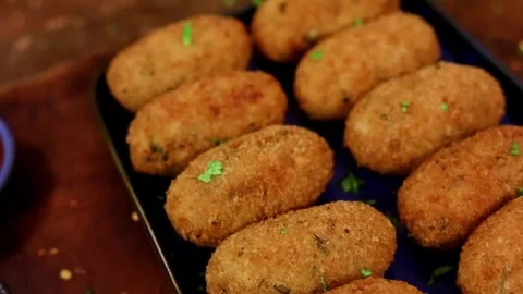 Chilli Garlic Cutlet Rolls served crispy with spiced potato filling Stock Footage 333192854
