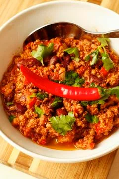 Chilli with minced  beef and herbs on white bowl Stock Photos