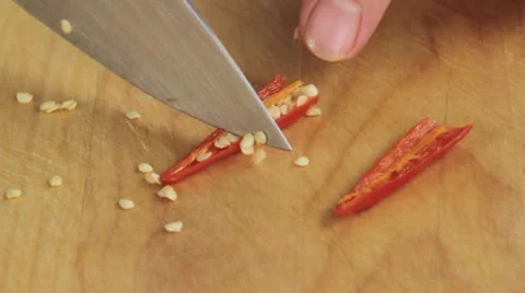 A chilli pepper being deseeded Stock Footage 24666673