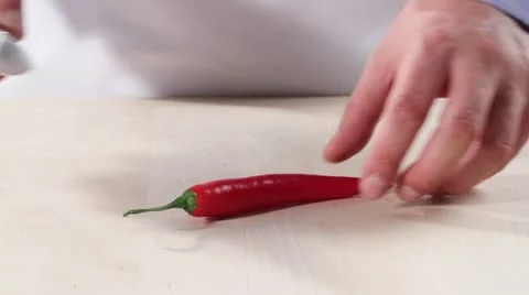 The chilli pepper being halved and deseeded Stock Footage 24673217