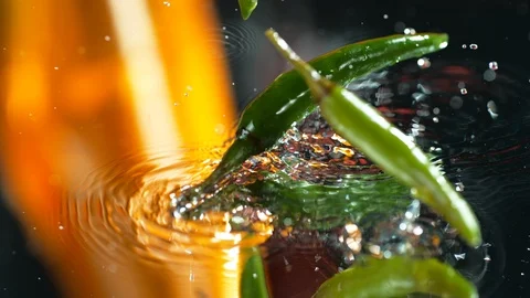 Chilli Pepper Falling Into The Water Slow Motion Stock Footage 113191631