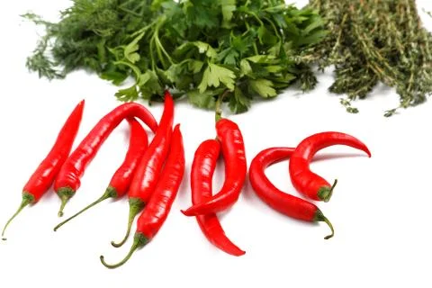 Chilli pepper  parsley thyme on a white background Stock Photos