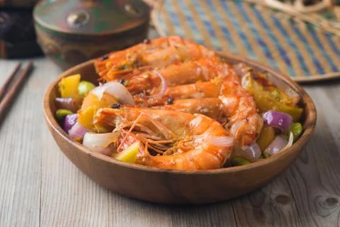 Chilli prawns in traditional setting Stock Photos