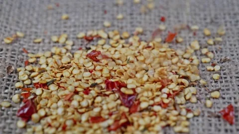 Chilli seed falling on chilli bag 4k 25fps Stock Footage 272164581