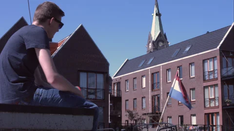 Chilling, in front of a dutch flag. Stock Footage 49166999