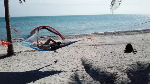 Chilling in Hammock Drone Florida Beach Pan Out Vídeos de archivo 88414826