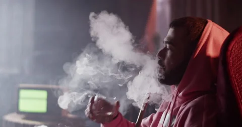 Chilling man with drink and hookah in bar Stock Footage 229483474