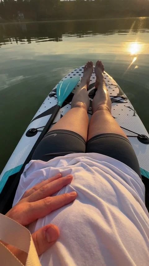 Chilling on supboard on sunset Stock Footage 255594699