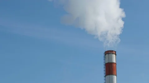 Chimney and smoke on blue sky video Video stock 129296071