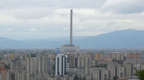 The chimney of CHPs and blocks of flats seen from above, Brasov Stock Footage 57938856