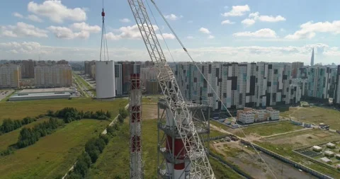 Chimney pipe construction, the crane lifts the pipe segment. Aerial shot 库存影片 141183166