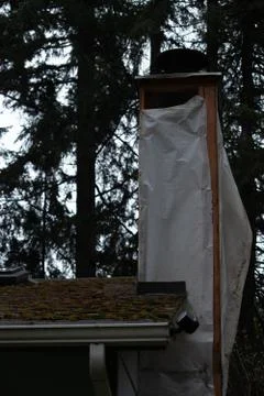 A chimney in the process of being refinished Stock Photos