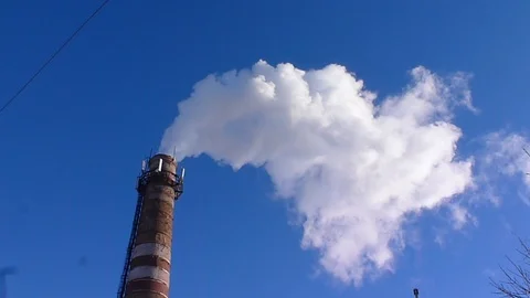 Chimney smoke with blue sky Stock Footage 125873698