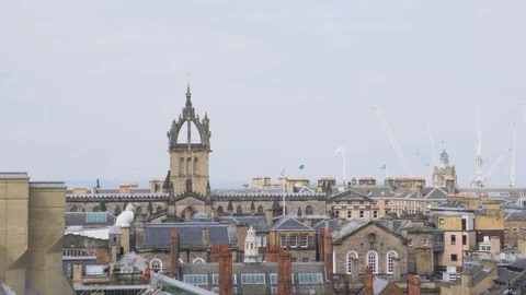 Chimney smoke stack cloud, cathedral spire, and Edinburgh rooftops Video stock 116013872