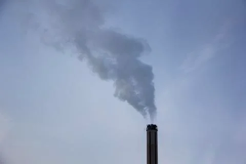 Chimney Smoking Stack. Air Pollution and Climate Change Theme. Stockfoto's