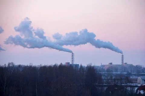 Chimney Smoking Stack. Air Pollution and Climate Change Theme. Стоковые фото