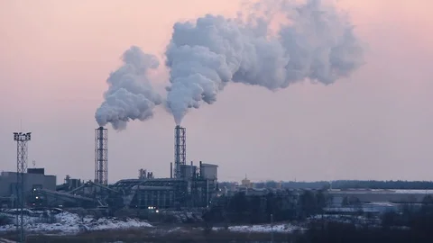 Chimney smoking stack on sunrise. Air pollution and climate change theme. Видео 86690747