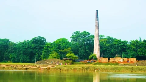 Chimney Stack At Brick Field Plant By The River shore In Rural Of Video stock 275842099