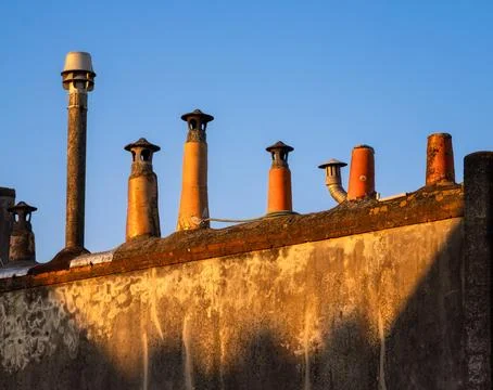 Chimney Stacks at Sunset on Rooftop Stock Photos