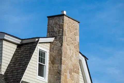 Chimney from the stone fireplace Stock Photos