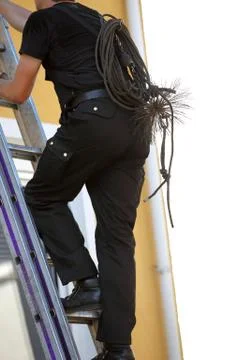 Chimney sweep climbing a stepladder Fotos de archivo