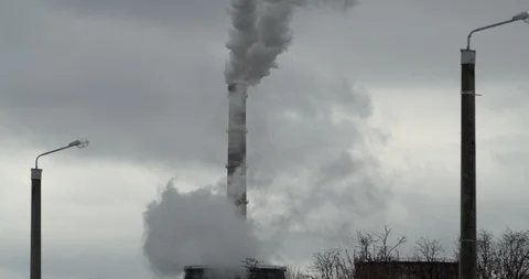 From the chimney there is acrid gray smoke. Close-up. Slow motion. 4K. Stock Footage 103958415