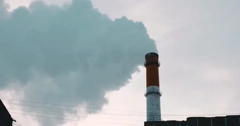A chimney with thick white smoke against the background of the sunset sky. Stock Footage 170667092
