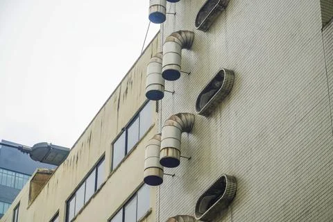 Chimney ventilation system on outside building with copy space Stock Photos