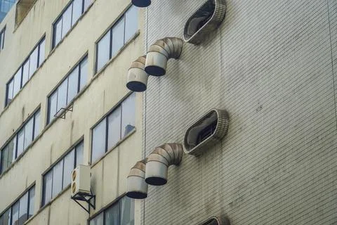 Chimney ventilation system on outside building with copy space Stock Photos