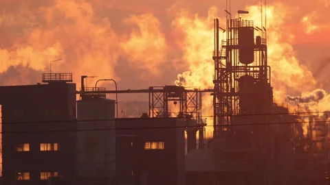Chimneys against the orange sky, 4K slow motion Stock Footage 166703049