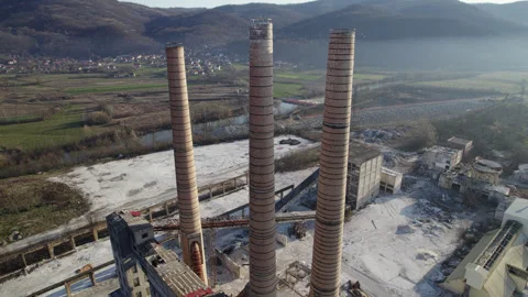 Chimneys of an old abandoned factory with circular camera movement Stock Footage 330686993