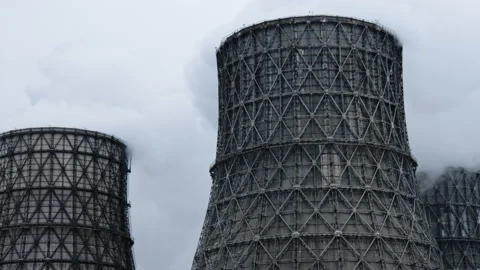 Chimneys of power facility station. Factory pumping out smoke and steam Stock Footage 219640010
