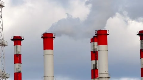 The chimneys from which the smoke comes out against the background of the sky. Stock Footage 171149384