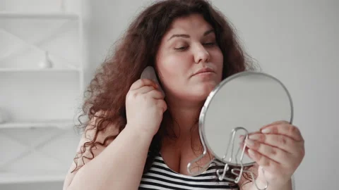 Chin massage gua sha technique overweight woman Stock Footage 164660242