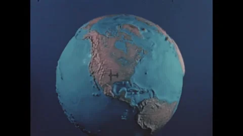 CHINA - 1939 - A stop-motion animated globe is spun as a war correspondent Stock Footage 340668535
