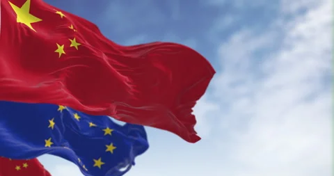 China and EU flags wave together against blue sky, symbolizing internationa.. Stock-Footage 318225635