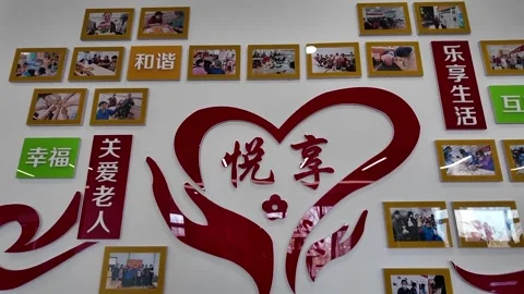 China: Beijing launches robot-empowered elderly care station Stock Footage 330994502