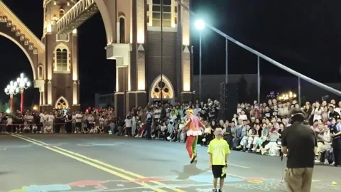 China: Blindfolded boy keeps jumping after rope trick at night performanc... Stock Footage 344299055