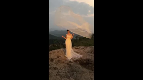 China: Bride catches flying veil with perfect timing during photoshoot in... Stock Footage 344196635