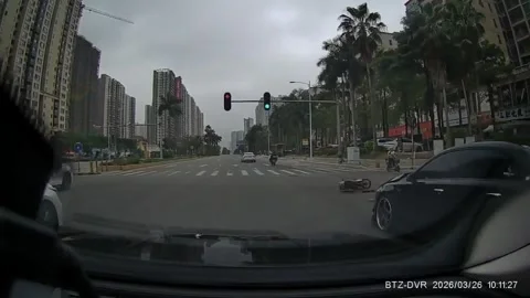 China: Car collides with motorcycle at intersection in Guangdong, China 스톡 동영상 331801546