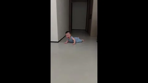 China: Chinese babys first walking lesson starts with a fall and ends wi... Stock Footage 340600980
