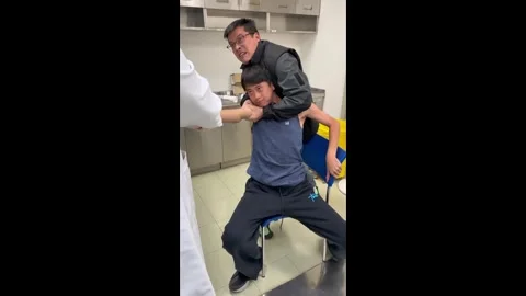 China: Chinese practitioner performs instant dislocation reset on young b... Stock Footage 323988520