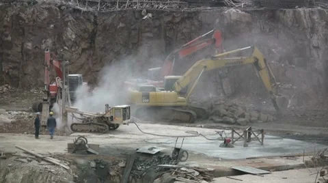 China construction site excavators workers dust machinery pollution 動画素材 7905472