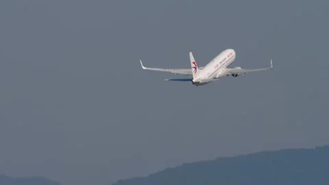 China Eastern Airlines take off, long shot Stock Footage 305321773