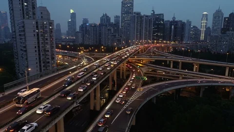 China elevated highway at night - illuminated intersection Shanghai drone shot Stock Footage