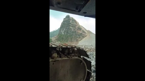 China: Fascinating controlled explosion on a small hill in Guangxi, China... Video stock 320653070